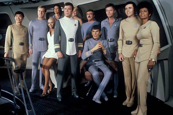 1979 --- Cast members on set of the 1979 film Star Trek: The Motion Picture include from left: George Takei, Stephen Collins, Persis Khambatta, Majel Barrett (in back), William Shatner, Grace Lee Whitney (in back), James Doohan, Leonard Nimoy, DeForest Kelley, Walter Koenig, and Nichelle Nichols. --- Image by © Steve Schapiro/Corbis