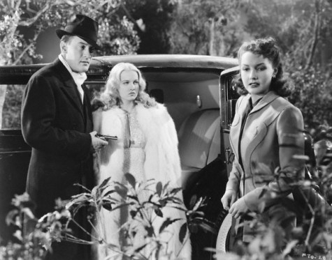 ca. 1942 --- Reporter Ann Riordan (Lynn Bari) stands near the Falcon (George Sanders) who is threatening Diana Kenyon (Helen Gilbert) with a gun in the 1942 mystery The Falcon Takes Over. --- Image by © John Springer Collection/CORBIS